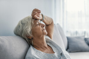 Elderly woman experiencing chronic fatigue.