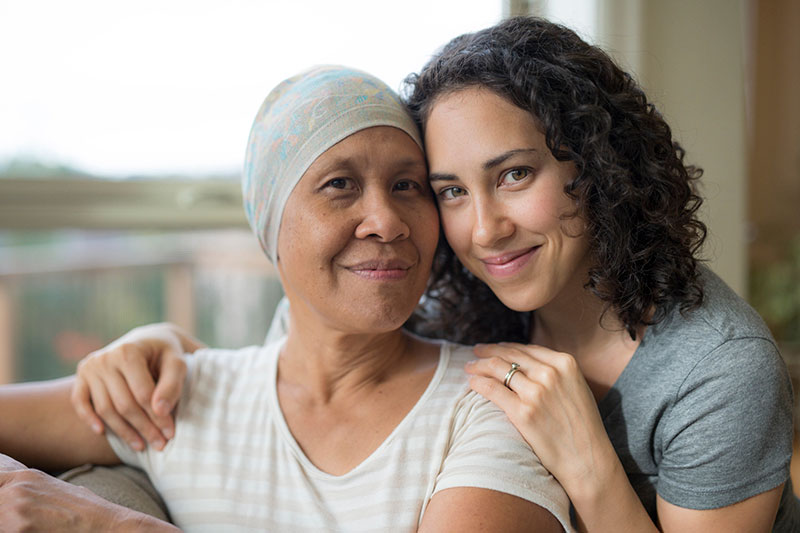 woman-with-cancer-and-caregiver