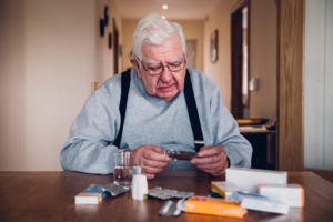 senior man reviewing medications