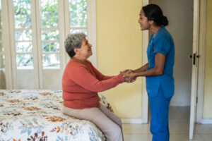 caregiver assisting senior lady